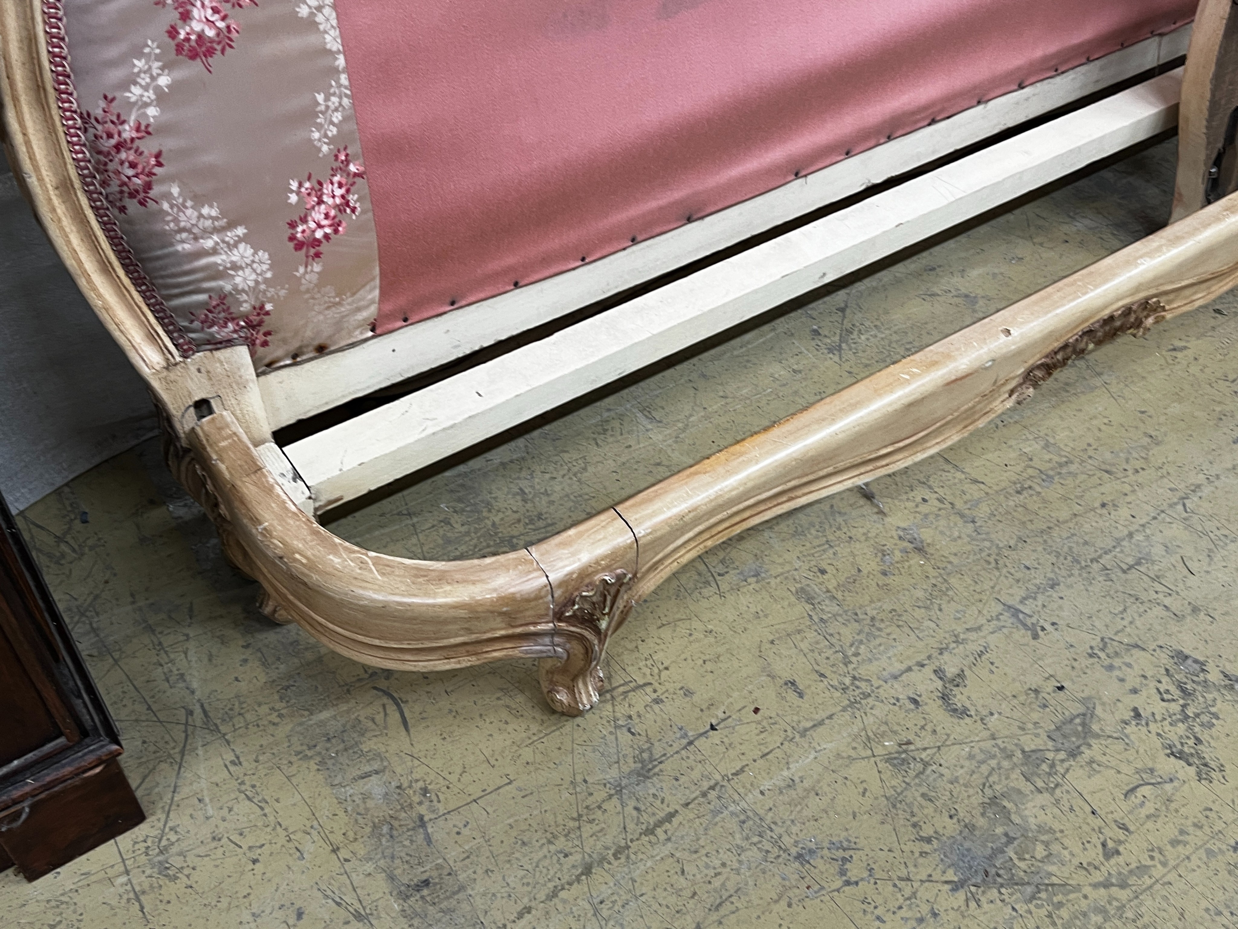 A Louis XV style satin upholstered bed frame, width 144cm, height 145cm